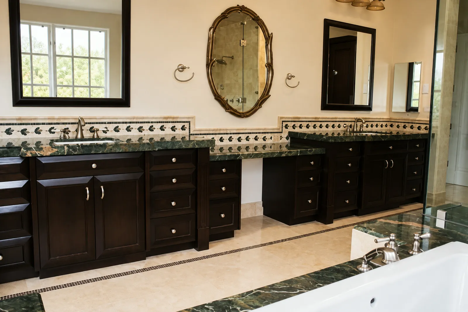 Bathroom with twin dark vanities and green marble tops