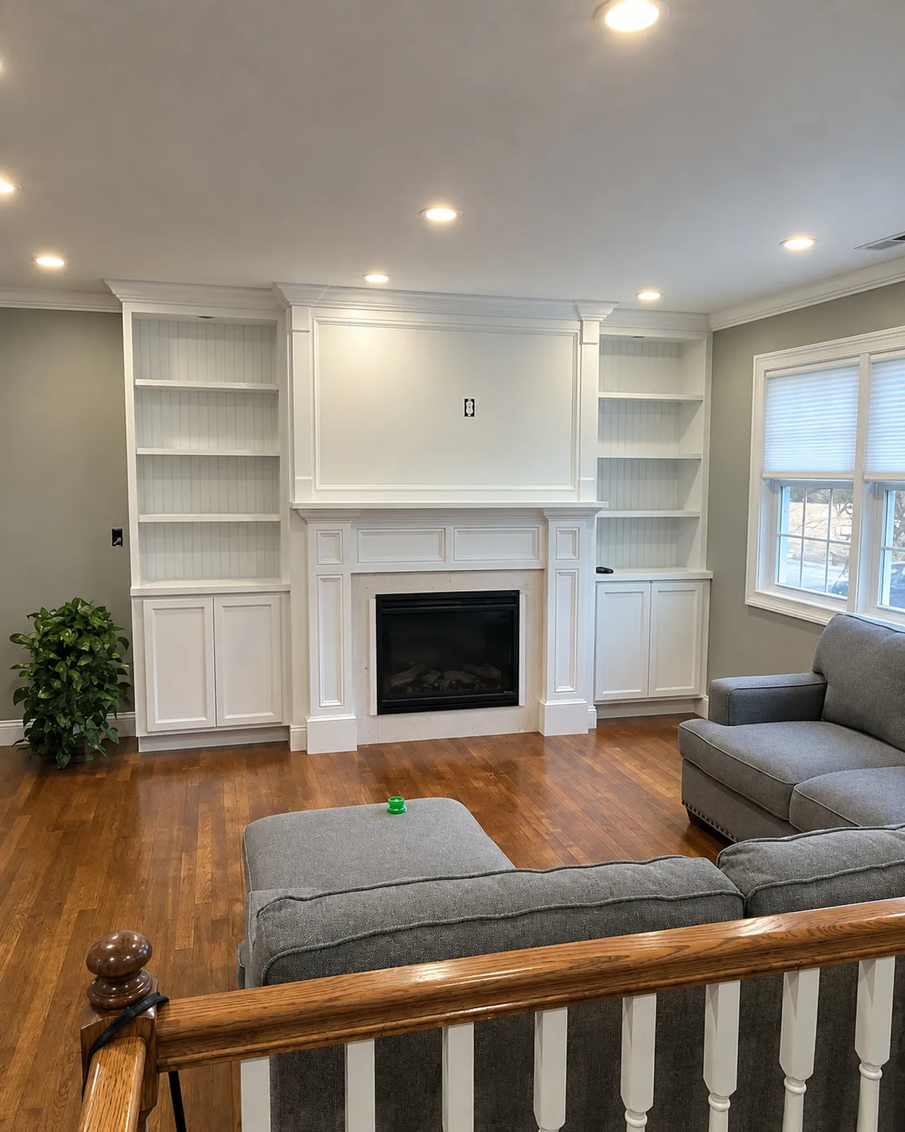 Fireplace mantel with flanking built-in shelves